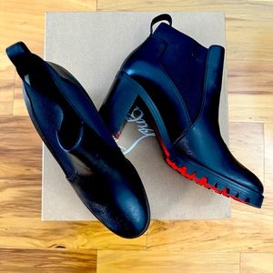 Like New! Womens Christian Louboutin booties. (Red bottom sole) a must have!